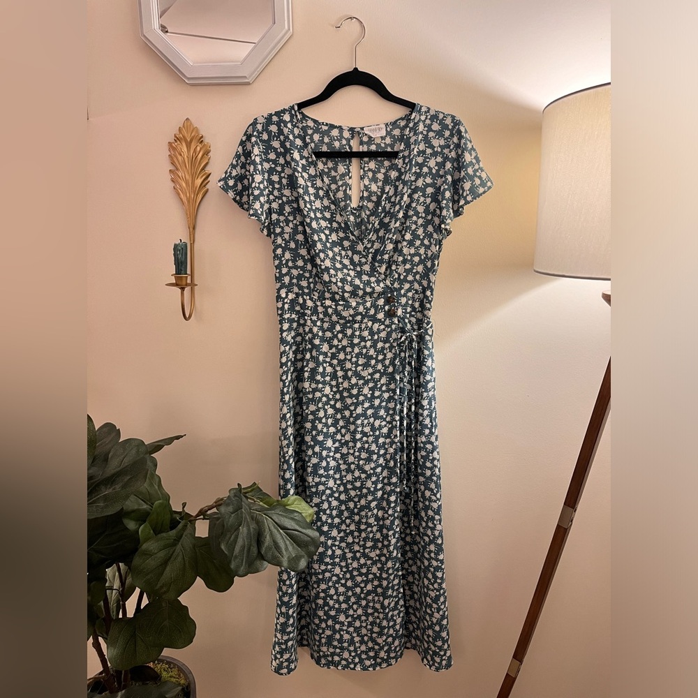 Blue floral faux wrap dress with buttons, tie, and slit